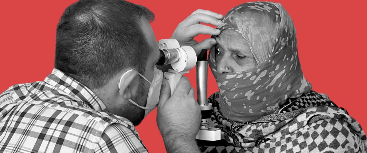 William Van De Car uses a portable slit lamp to examine a local on the DOVS global ophthalmology trip to India